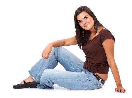 casual woman on the floor smiling isolated over a white background