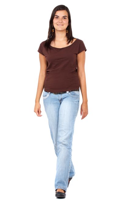 casual woman walking and smiling portrait isolated over a white background
