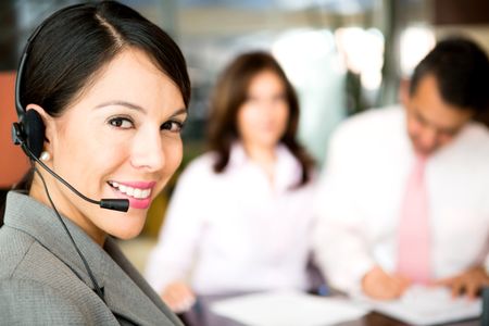 Friendly woman working as a telemarketing agent
