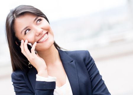 Business woman talking on her cell phone