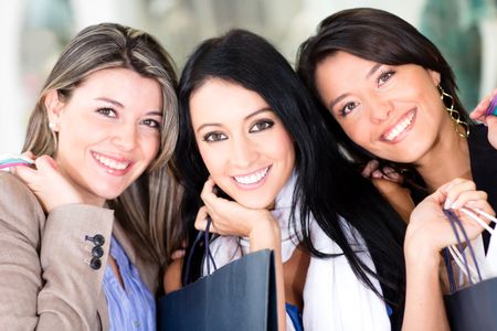 Group of beautiful women shopping and holding bags