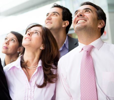 Portrait of a successful business team looking up