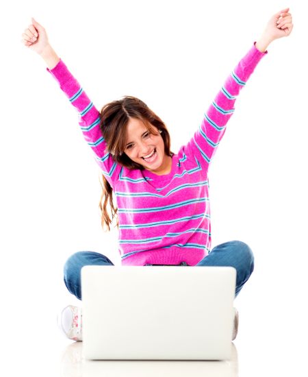 Excited woman with a laptop and arms up - isolated over white