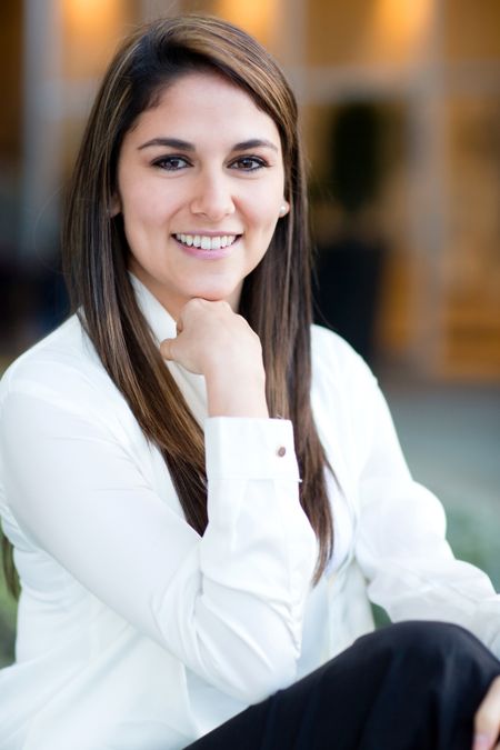 Successful business woman looking confident and smiling