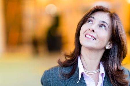 Portrait of a thoughtful businesswoman looking up