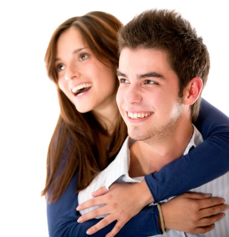 Happy loving couple laughing - isolated over a white background