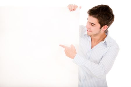 Man holding a placard and pointing at it - isolated over a white background