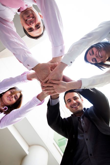Successful business group with hands together Ã¢Â?Â? teamwork concepts