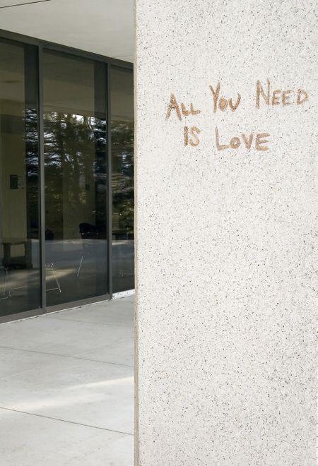 Graffiti on college campus (focus on "All You Need Is Love")