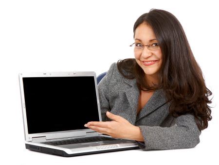 Business woman displaying a laptop computer - isolated over a white background