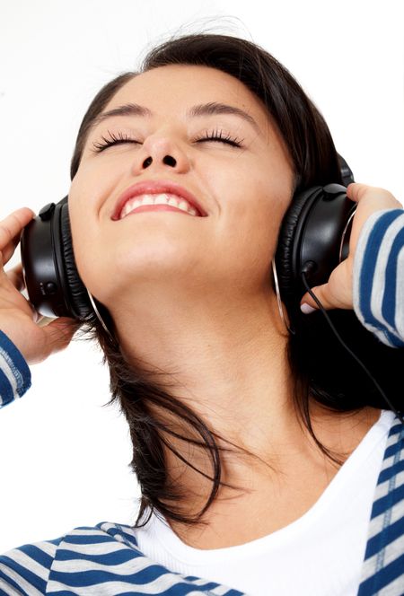black girl listening to music looking happy isolated over white