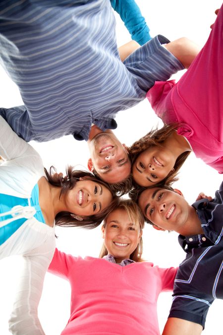 Group of people hugging in a circle isolated over a white background