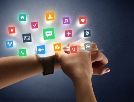 Naked female hand with smartwatch and  application labels around and dark background