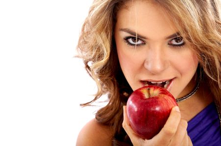 casual woman with an apple isolated over a white background