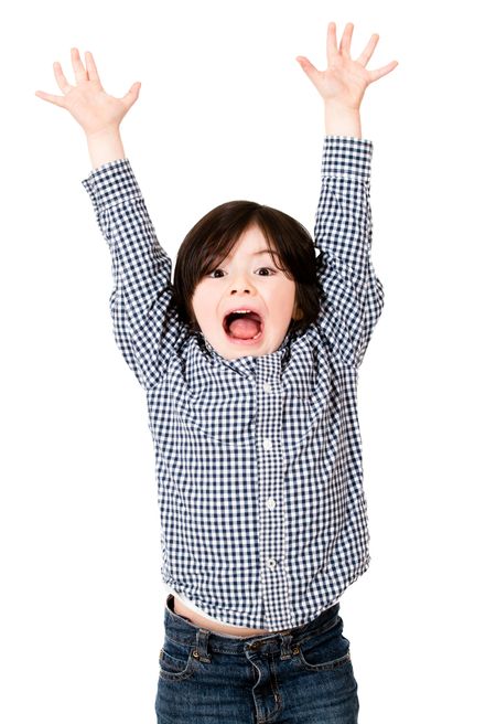 Excited boy with arms up - isolated over a white background