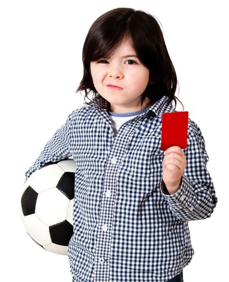 Boy playing football with holding a red card - isolated over