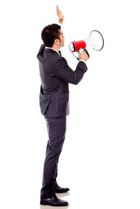 Businessman speaking loud through a megaphone - isolated over a white backround