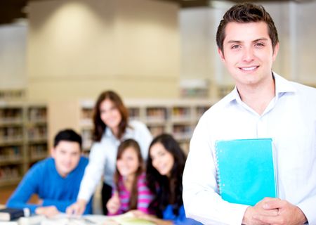 College male student with a group at the library