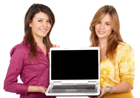 girls displaying a laptop computer smiling - isolated over a white background