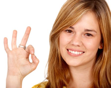 woman doing the ok sign isolated over a white background
