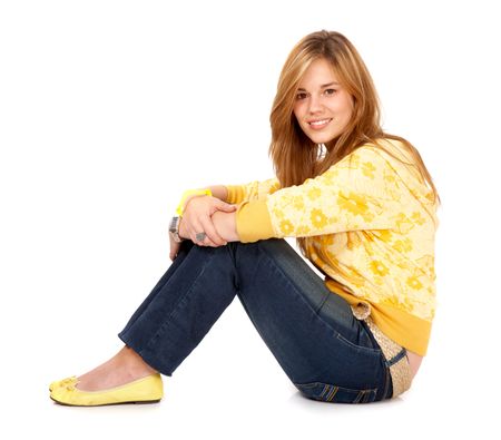 blond girl smiling on the floor isolated over a white background
