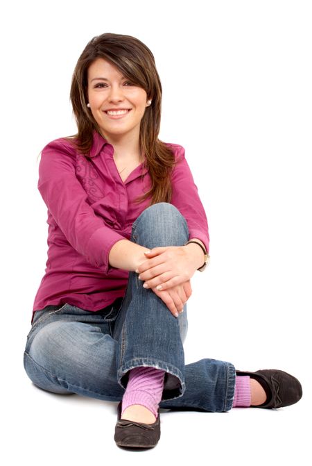 casual woman smiling on the floor isolated over a white background