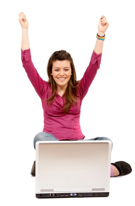 casual girl success on the internet on a laptop computer isolated over a white background