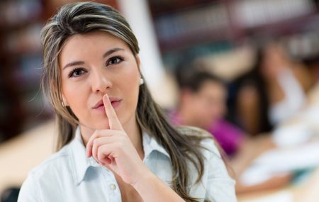 Female student asking for silence in the library