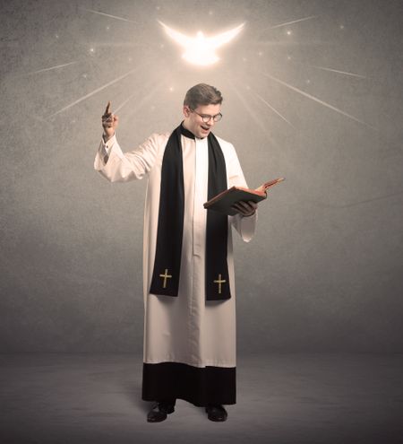 holy-priest-reading-prayer-holy-bible-1063792274 A holy priest reading a prayer from the holy bible with illustrated glowing angel above his head concept.
