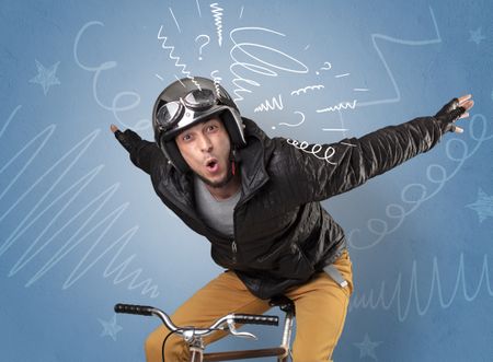 Young foolish crazy rider with doodle on the background