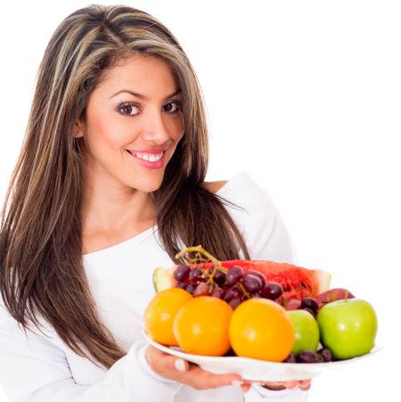 Healthy woman on a fruit based diet - isolated over white background
