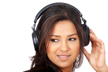 black woman listening to music looking happy isolated over white