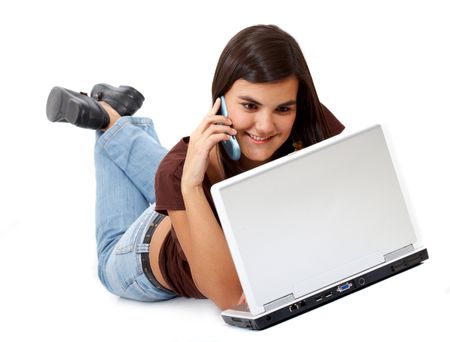 casua woman talking on the phone while working on a laptop computer - isolated over a white background