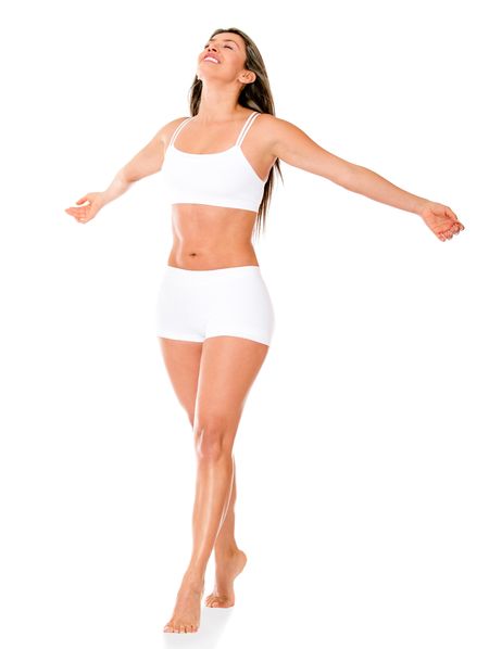 Woman enjoying her freedom with arms open - isolated over a white background