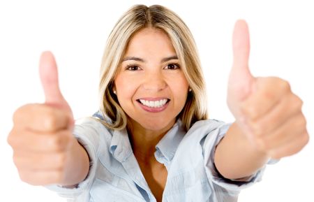 Happy woman with thumbs up and smiling - isolated over a white background