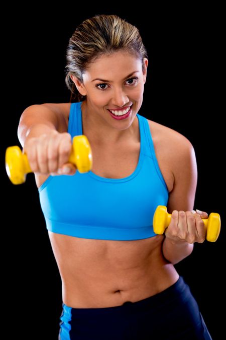 Woman exercising at the gym with free weights