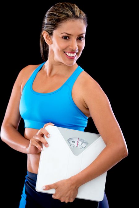 Weight loss woman holding a scale - isolated over a black background