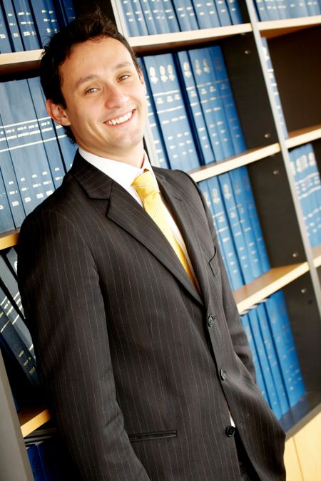 confident business man smiling in his office