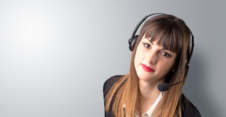 Young female telemarketer on a white background