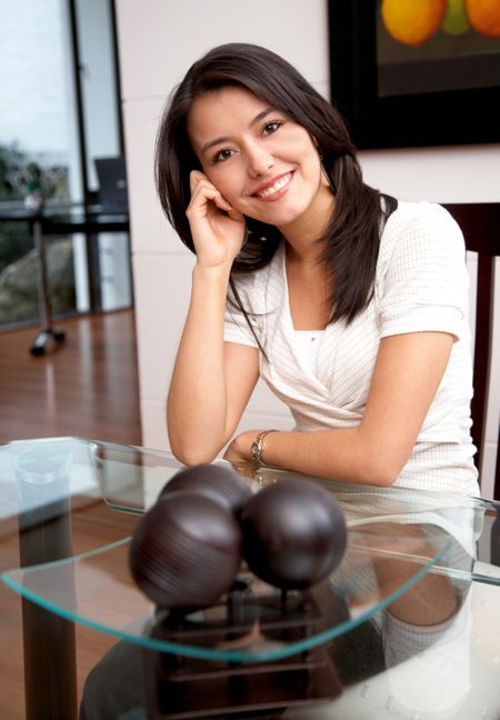 beautiful young woman smiling and relaxing at home