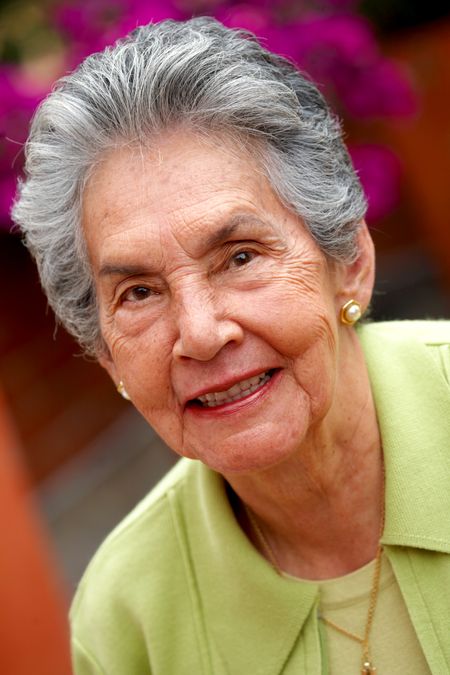senior woman portrait smiling outdoors