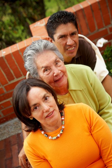 happy two generation family portrait smiling outdoors