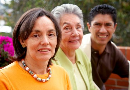 happy two generation family portrait smiling outdoors