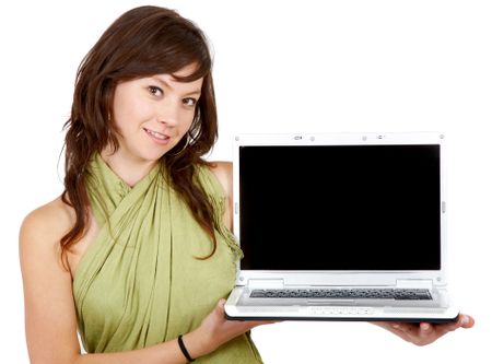 casual girl displaying a laptop computer smiling and isolated over a white background