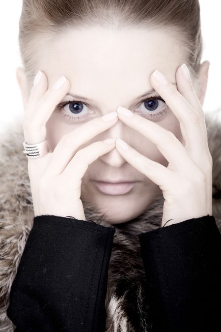 fashion woman portrait with her hands on her face over a white background