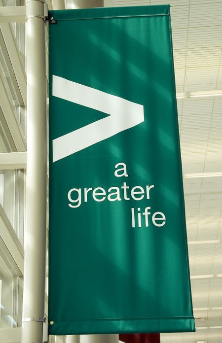 Banner in college hallway: "a greater life"