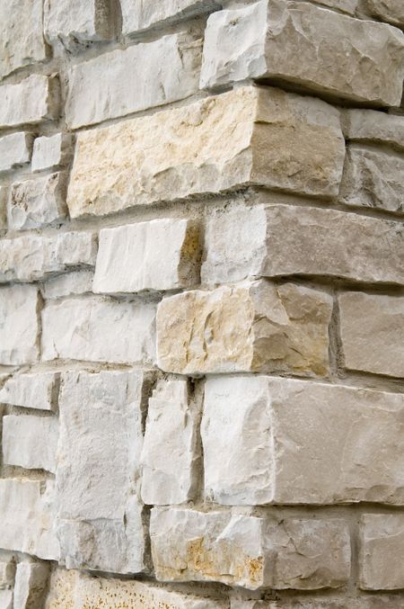 Close-up of outdoor column with sandstone facing