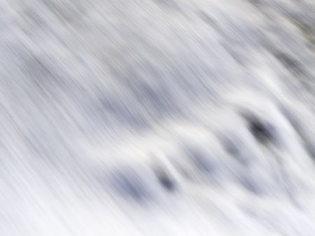 Abstract of motion blur: Wave washing over human footprint on beach