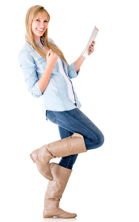 Happy woman with a tablet computer celebrating - isolated over white