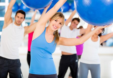 Group of people doing Pilates with a Swiss ball